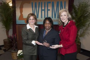 JSU Vice President for Research and Scholarly Engagement Loretta A. Moore, Ph.D., center, accepts the 2013 Women in Higher Education Mississippi Network Leadership Award from conference coordinator Amy Tuck (left) of Mississippi State University and coordinator-elect Jan Reid-Bunch of Itawamba Community College.-Photo courtesy of Mississippi State University