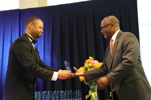 Jarret Carter, founder of the HBCU Digest and HBCU Awards, gives the award for Best Marching Band to Dowell Taylor, director of bands at JSU.