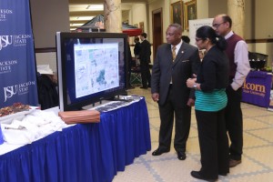 Dr. Sudha Yerramilli and Dr. D. Philip Nittala (at right) explain how DISCOVER MS works to Rep. America Chuck Middleton.