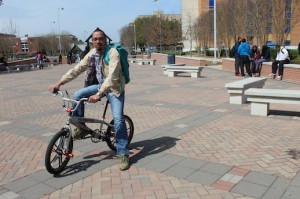 Thaddeus Wright, a senior English major from Chicago, rides his bicycle from his apartment in the Palisades daily.