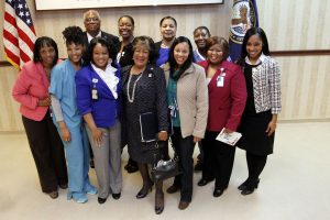 JSU President Carolyn W. Meyers poses with G.V. Montgomery Veterans Center employees who are also JSU alumni.