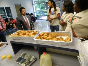 International Programs Director Dr. Lokesh Shivakumaraiah (left) speaks with students during GEAR UP Senior Academy