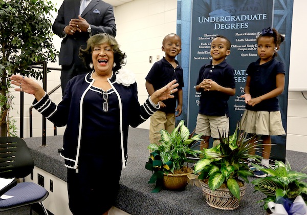 Jackson State University President Dr. Carolyn W. Meyers regals faculty and staff at the College of Education and Human Development with her own stories about teaching Tuesday, Sept. 30, 2014. She was presented with flowers by 4-year-old preschoolers Caleb Banks, Luke McGee and Paige McLin, right. (Photo by Charles A. Smith, JSU)