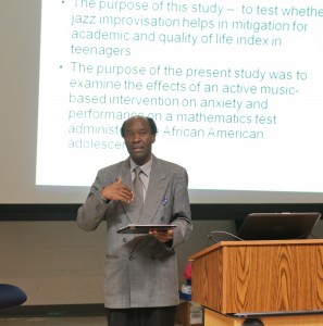 Speaking at the Dollye M.E. Robinson College of Liberal Arts Building, Dr. David Akombo, assistant professor, director of music education and graduate coordinator in the department of music, outlined various studies on the positive and negative effects of music on Tuesday, Nov. 11, 2014. (Photo by Anissa Hidouk, JSU)