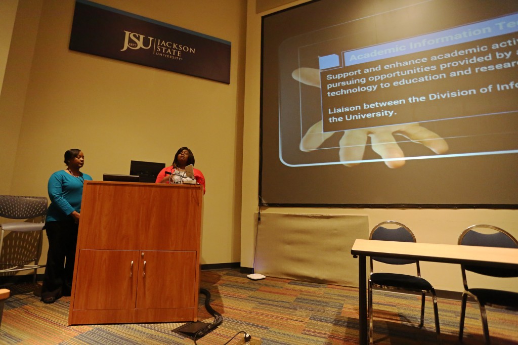 JSU Systems Integration Analyst Kedra Taylor (left) and Director of Academic Internet Technology Emily A. Miller-Bishop talk about technology integration in the classroom environment at an Innovation Month seminar Tuesday, Nov. 10, 2014, at the Student Center. (Photos by Charles A. Smith, JSU)