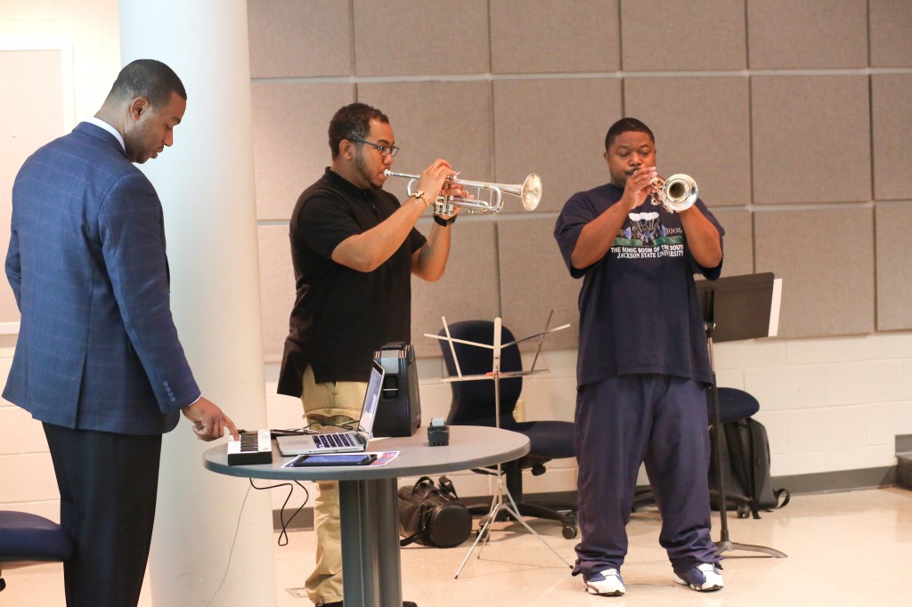 Andrew Lewis (left), an adjunct professor of music, demonstrates chords from jazz and blues music with the help of music students Selwyn Ware (right) and Craig West. (Photo by Anissa Hidouk, JSU)