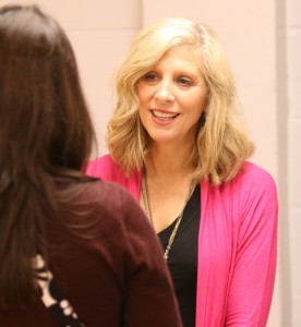 MAHPERD outgoing President Mary Ann Simpkins talks with a training class member Thursday, Nov. 7, 2014, at JSU.