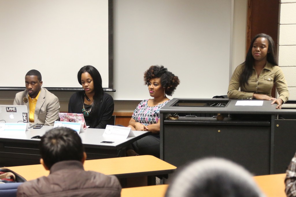 Avi’Yam Jordan of Good as Gold Enterprise speaks at a panel discussion Tuesday, Nov. 18, 2014, during Global Entrepreneurship Week. Sitting, from right, are: Jessica Simeon, owner of Jessicasimeon.com Entertainment and Lifestyle Blog; Regina Toney, COO of Good as Gold Enterprise; and Kris Campbell of The Kris Campbell. (Photo by Charles A. Smith)