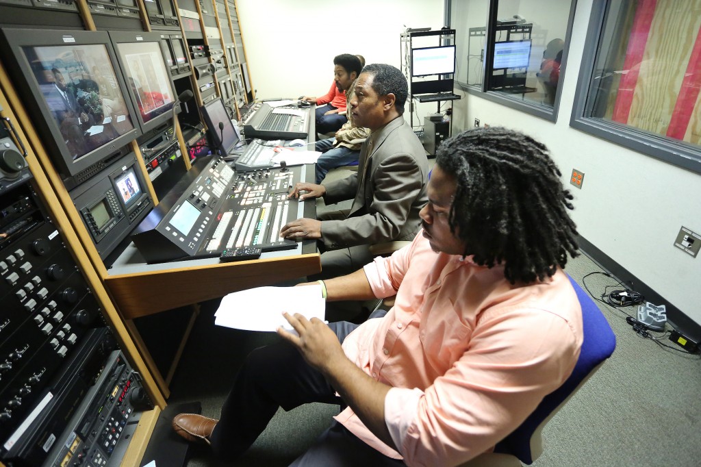 Behind the scenes at JSUTV's 'Metro Morning LIve,' Production Manager Keith Collins (center) directs the show with the help of Assistant Production Manager Jamichael Chambers (foreground), Audio Technician Greg Smith and Video Specialist Kari Thomas. (Photos by Charles A. Smith, JSU)