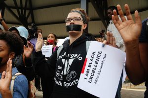 Krystal Mooney, a senior psychology major from Blue Mountain, Miss., marches to protest the Ferguson, Mo., grand jury inaction in the shooting death of Michael Brown, Dec. 1, 2014. (Photos by Charles A. Smith, JSU)
