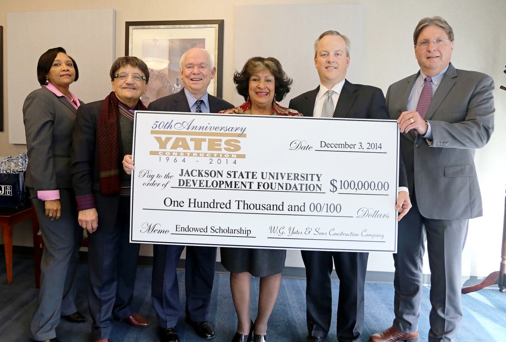 Jackson State University President Carolyn W. Meyers (center) beams after executives from Yates Construction presented a gift to help establish an enduring partnership with the 50-year-old company. They envision an opportunity to create internships and future employment for graduates. Joining Meyers (from left) are: Constance Lawson, JSU development officer; Dr. Richard Alo, dean of the JSU College of Science Engineering and Technology; W.G. “Bill” Yates, chairman of Yates Construction; William Yates, president of Yates Construction; and Paul Musick, vice president of Yates Construction. (JSU photo by Charles Smith).