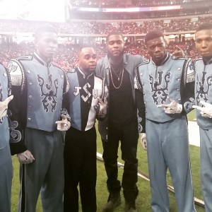 Rapper Big K.R.I.T. poses with members of the Sonic Boom of the South at the Honda Battle of the Bands in the Georgia Dome, Jan. 24, 2015. (Photo by Ashton Hall, JSU)