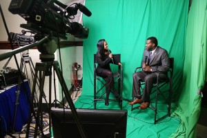 Aviyam Jordan, 21, a senior in Mass Communications from Chicago, Ill., interviews state Rep. Bryant Clark, D-Lexington. (Photo by Charles A. Smith, JSU)
