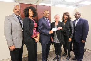 Dr. Richardo Brown, dean of the College of Public Service (third from left) receives a check for $25,000 from Kim Adams, CEO of Social Work p.r.n., for student scholarships at the college’s School of Social Work on Jan. 21, 2015. From left, are: Dr. Jerry Watson, chair, Graduate Programs, School of Social Work; Shalondria Hill of Social Work p.r.n; Brown; Adams; Dr. Theresia Ratliff, director of Field Education in the School of Social Work; Charles King, development officer, Division of Institutional Advancement. (Photo by Charles A. Smith, JSU)