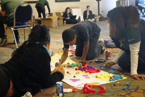 Students and Babson College faculty lay out plans for lemonade stand dynamics at Lemonade Day training at Jackson State University, Jan. 8, 2015. (Photo by Anissa Hidouk, JSU)