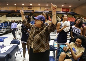 Coach Dr. Mary M. White, interim vice president of Institutional Advancement, cheers her team on Local and Statewide Public Officials Night held Monday at the JSU/Texas Southern University women's and men's basketball games, Feb. 16, 2015. (Photo by Charles A. Smith)