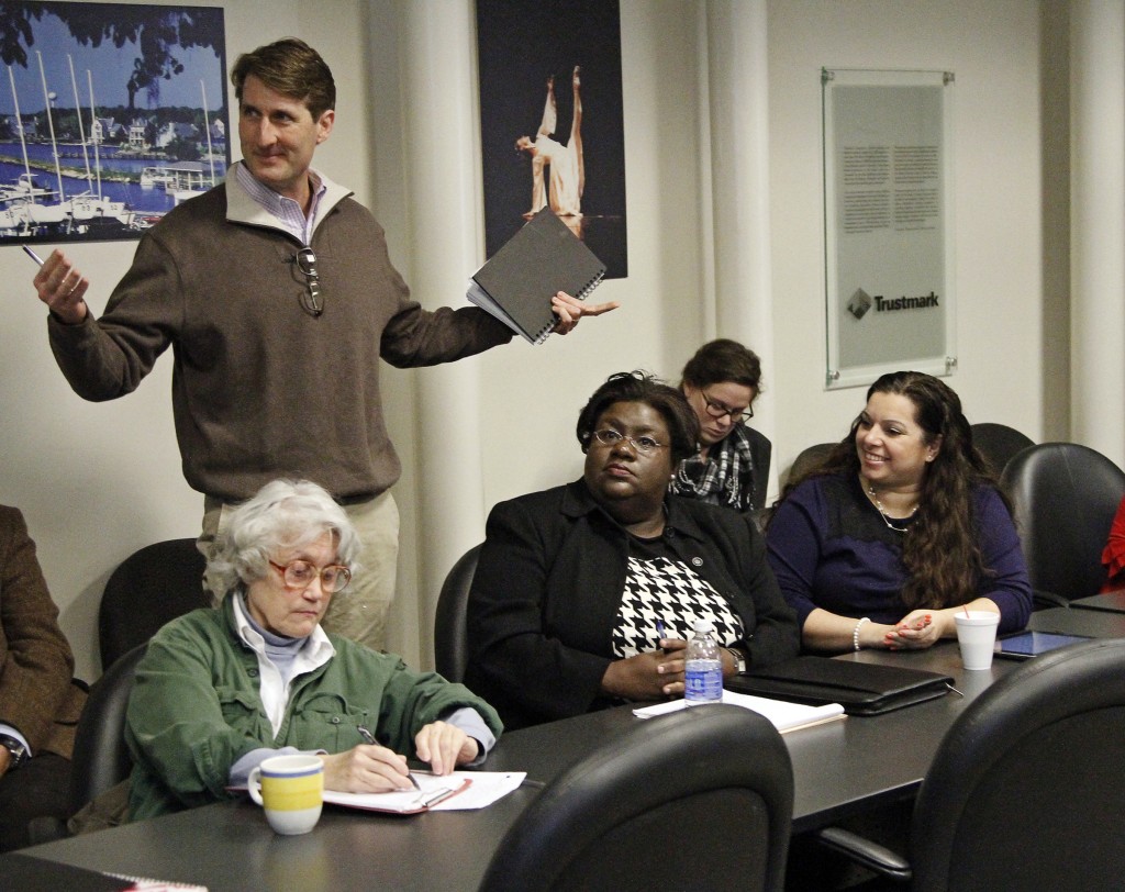 Jeff Good, managing partner of Dollars & Sense Creative Consulting and president of Mangia Bene Restaurant Management Group Inc., makes a point about engaging businesses in Jackson’s revitalization plan, Thursday, Jan. 12, 2015, at the Greater Jackson Chamber Partnership office. Listening (sitting, from left): Jan Hillegas, community activist, and Alondria Owens and Heather Wilcox of JSU’s Office of Community Engagement. (Photo by Deontae Williams, JSU)