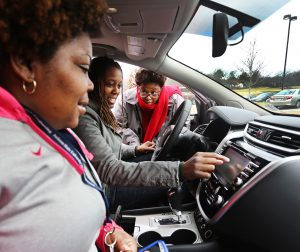 Melinda Heath with Nissan explains the features of a 2015 Murano to Lauren Taylor (driver’s seat), a senior in computer engineering from Jackson, and Jasmine Jenkins (passenger seat), a junior in computer engineering from Mobile, Ala., during Nissan Day, Feb. 27 at Jackson State University. (Photo by Charles A. Smith, JSU)