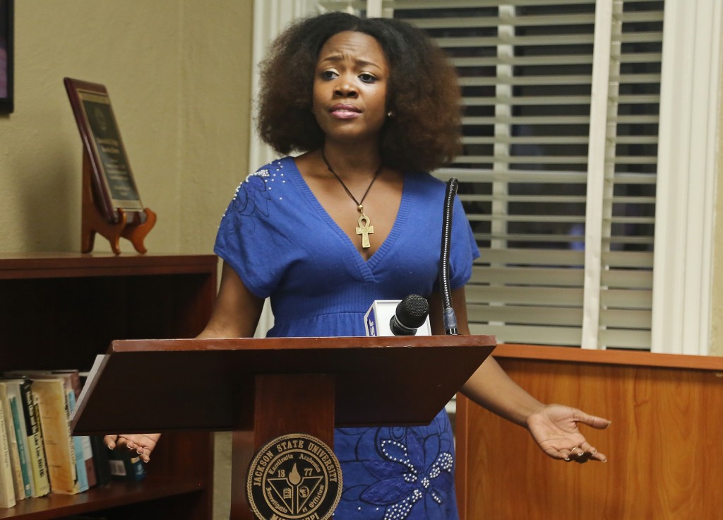 LaShundra Thomas of the Blue Light Underground Ensemble recites from "for colored girls who have considered suicide/when the rainbow is enuf" at the Jackson Reads kickoff and reception March 3, 2015, at JSU’s Margaret Walker Center for the Study of the African-American Experience, (Photo by Charles A. Smith, JSU)