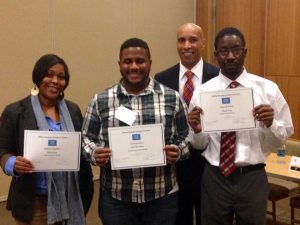 Three JSU graduate students won awards in the paper competition held at annual Alabama-Mississippi Sociological Association meeting in Montgomery, Ala., Feb. 26-27. Shown (from left, front) are: Fallon Sutton, Christopher Peace and Charlie Coats; AMSA president Troy Adams of Alabama State University (standing behind) congratulated the three students.