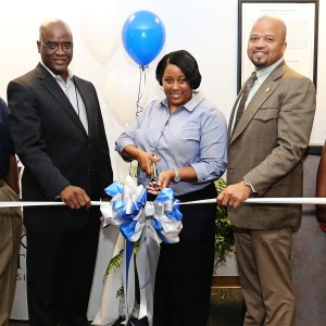 JSU Human Resources Executive Director Robin Pack (center) cuts the ribbon for the new HR offices at the Mississippi e-Center @ JSU with Michael Thomas, vice president for Business and Finance (left) and Marshand Crisler, deputy chief administrative officer for the city of Jackson, Friday, April 17, 2015. (Photo by Charles A. Smith, JSU)