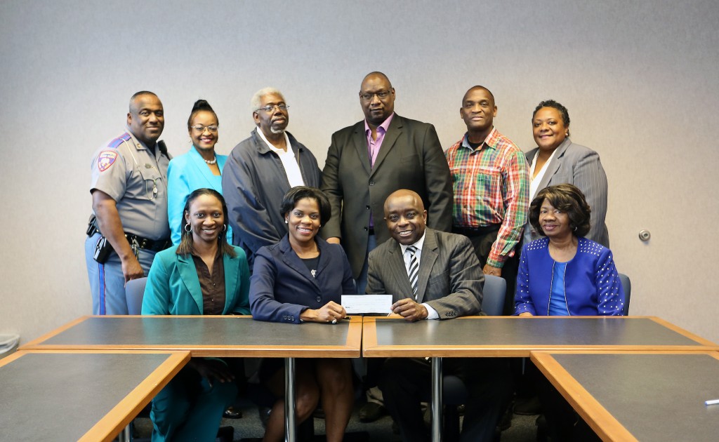Participants at the check presentation by the Madison County Chapter of the Jackson State University National Alumni Association earlier this year included, standing from left, Calvin Ousby Sr., Gwen Caples, Larry Goodwin, Mark Henderson, Floyd Williams and Angela Getter. Also attending the chapter’s first gift installment on campus were, seated from left, Sharron Williams, Madison County chapter president Dr. Barbara Ousby, JSU major gifts officer Charles King and Bobbie Wilson.