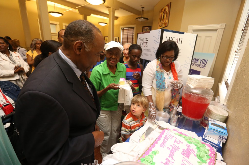Dr. Robert Smith, president of the board of directors for the Margaret Walker Center, admires the birthday cake honoring the centennial celebration of former Jackson State University professor Margaret Walker Alexander. Smith described the poet-writer as a national historic figure who helped shaped the lives of ordinary people. (Photo by Deontae Williams/JSU)