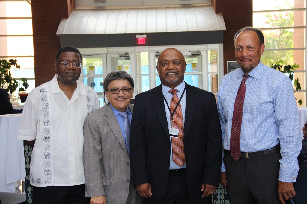 Dr. Timothy Turner, center, receives a welcome from Dr. Paul B. Tchounwou, left, associate dean of the College of Science, Engineering and Technology at JSU; Dr. Richard Aló, dean of CSET; and Dr. James C. Renick, provost and senior vice president of academic and student affairs.