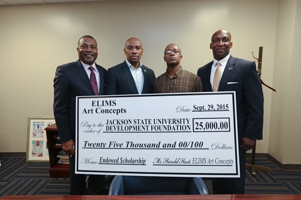 Jackson State University’s vice president of Institutional Advancement, Anthony Holloman, far right, and Dr. Ricardo Brown, left, dean of the College of Public Service celebrate a gift from Elim Art Concepts. The company, owned by Harold Hart, second from left, is located in the Jackson Medical Mall Campus of JSU. XXXXXX XXXX works for the company. (Photo by Charles A. Smith/JSU)