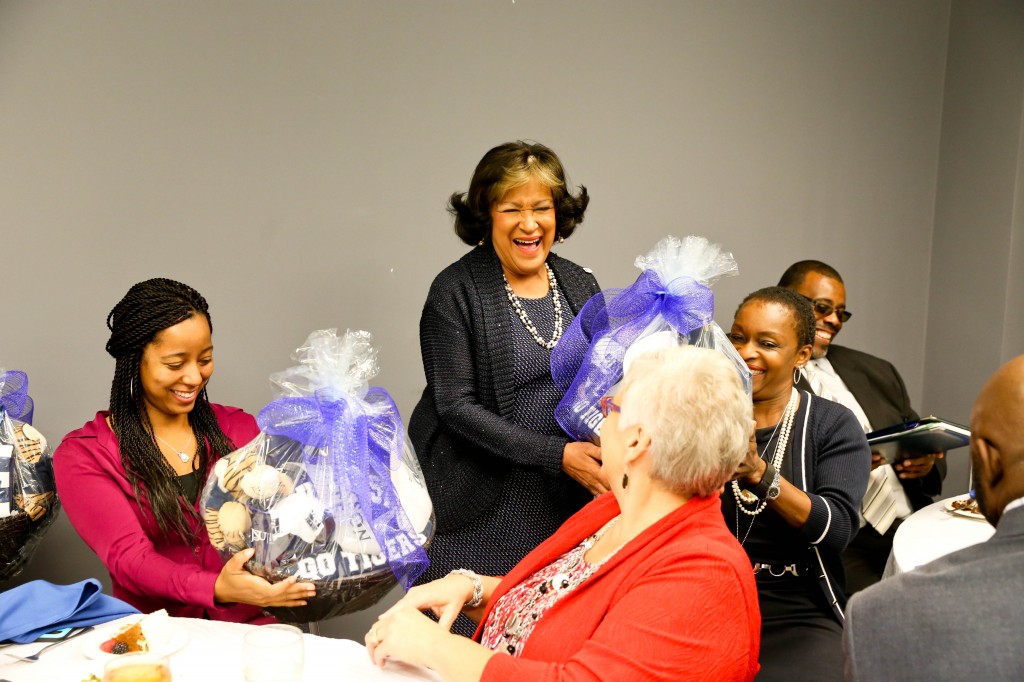 Meyers presents gift baskets to NCAA representatives during the recent Academic Progress Rate (APR) event. Photo by Deontae Williams.