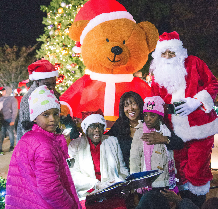 Santa and Mrs. Claus (Dr. Evelyn Leggette, JSU’s provost and senior vice president of Academic Affairs) shares holiday stories with the youths and adults. (Photo by Justin Hardiman/JSU)