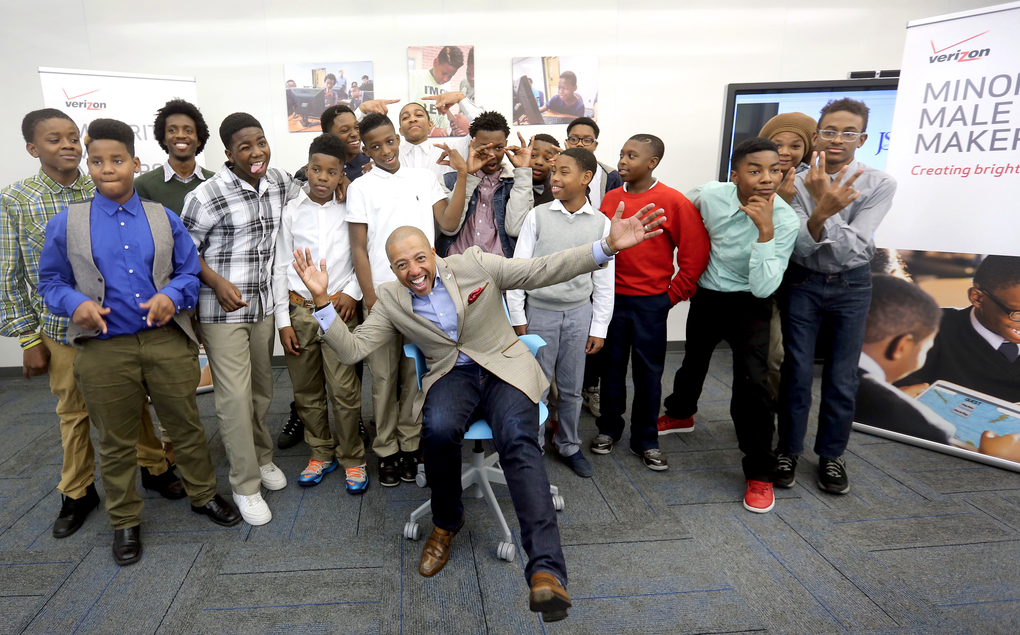 Music mogul and businessman Kevin Liles and Blackburn Laboratory Middle School students ham it up for the camera during the Verizon Male Makers Program on Thursday in the INNOVATE Center of the H.T. Sampson Library on the main campus. (Photo by Charles A. Smith/JSU)