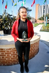 Woldu proudly displays her award from the City of Jackson. (Photo by Anissa Hidouk/JSU)