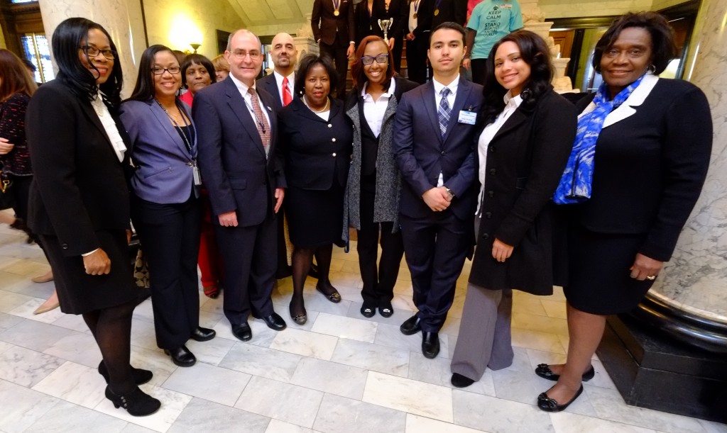 Members of iTECHealth Systems, (beginning fourth from right) Kaylin Kinchion, Omar Khattab and Kenya Gilkey, are congratulated by JSU administrators and staff on their business concept for reducing obesity. Pictured with the students are: (from left) Dr. Marinelle Payton, Almesha Campbell, Dr. Dorothy Browne, Dr. Kenneth Russ, Dr. Ramin Maysami, Dr. Loretta Moore and Dr. Evelyn Leggette.