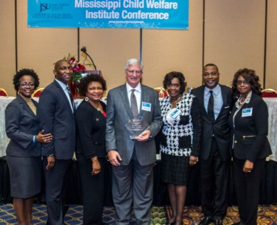 Opening plenary participants from JSU greet Dr. David Chandler after his speech (left to right): Rhonda Cooper, Esq., clinical assistant professor and Pre-Law Advisor; Anthony Holloman, vice president for Institutional Advancement; Dr. Gwen Prater, dean emeritus, College of Public Service; Dr. David Chandler, executive director of Mississippi Division of Family and Children’s Services; Dr. Evelyn Leggett, provost and senior vice president for Academic and Student Affairs; Dr. Ricardo Brown, dean of the College of Public Service; and Dr. Theresia Johnson-Ratliff, conference chair and clinical assistant professor.
