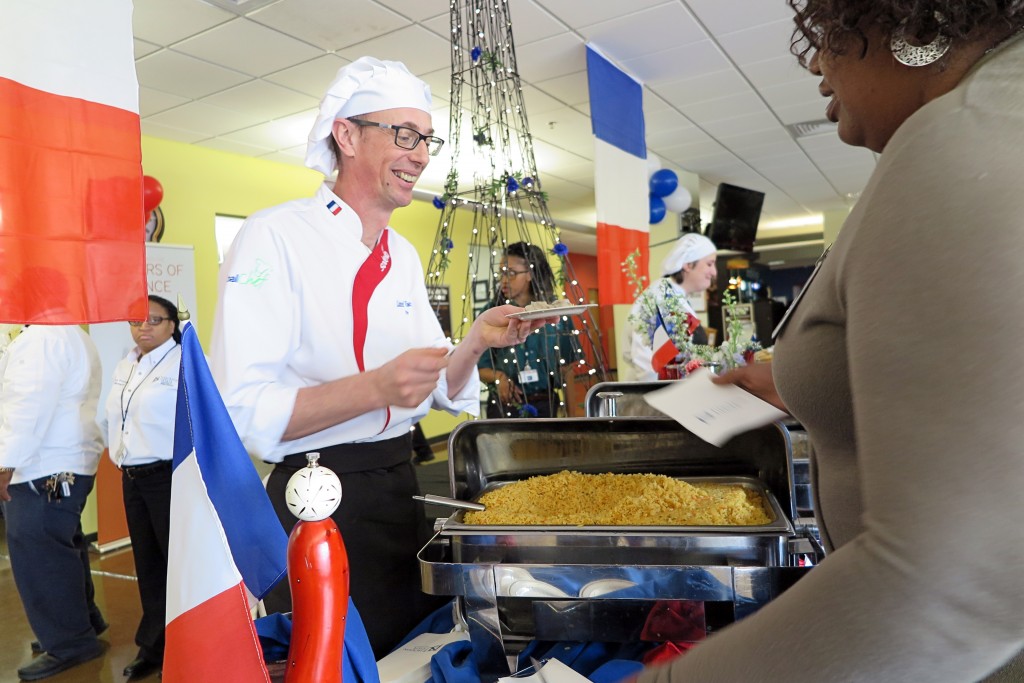 Global Chef Lionel Vandomme gleefully shares a taste of French with patrons in the dining area of the JSU Student Center on the main campus. (Photo by Charles A. Smith/JSU)