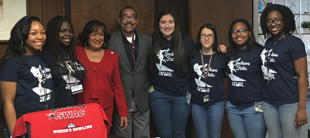 JSU President Carolyn W. Meyers congratulates the Lady Tigers Bowling Team and its coach, Michael Boykins, on their first-ever championship in the SWAC.