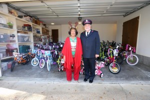 President Carolyn W. Meyers and Ken Chapman, area commander of the Salvation Army, showcase donated bicycles to be presented to area youth for Christmas. (Photo by Charles A. Smith/JSU)