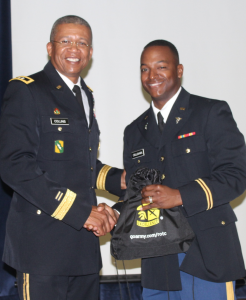 Guest speaker Major Gen. Augustus L. “Leon” Collins, adjutant general of the Mississippi and commanding general of the Mississippi Army and Air National Guard, congratulates 2nd Lt. Marcel Callahan. Photo by