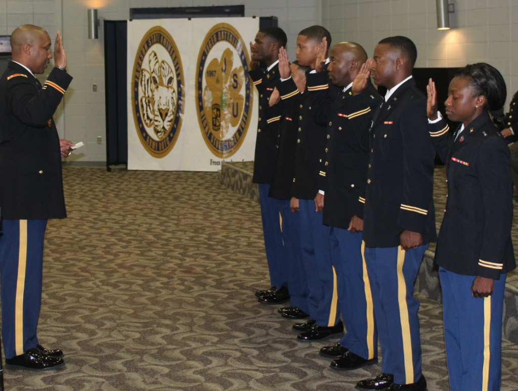 Lt. Col. Dexter M. Brookins, professor of military science in the College of Liberal Arts, administers the oath of office to the new officers. (Photo courtesy of Brooke Visoski)