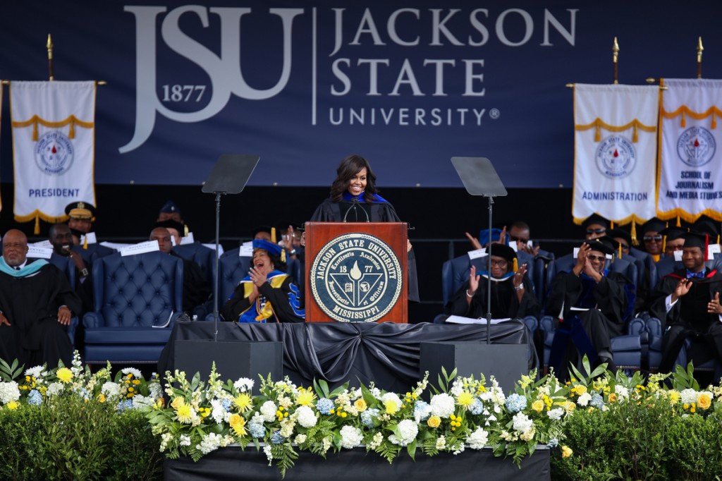 First lady Michelle Obama tells graduates “I know how hard you worked to make it to this day: studying up late into the night, writing and rewriting those papers, taking all those exams. Oh, my Lord. But I also heard that you have been able to have some fun over these past years as well – hanging out on the Gibbs-Green Plaza, turning up on Hot Spot Fridays at the Horseshoe. Don’t get too excited. Mom and dad are in the stands.” (Photo by Charles A. Smith/JSU)