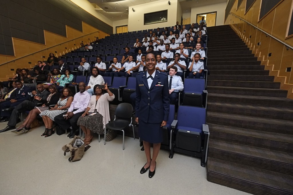 Lynn, pictured with her family and peers, told the audience to keep “pushing, striving for greatness and holding up the standard.” (Photo by Charles A. Smith/JSU)