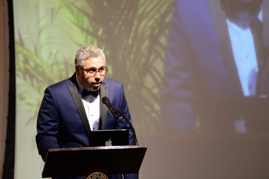 Dr. Luis Almeida, associate professor in the School of Journalism and Media Studies, presents the award for Outstanding Education Support, Initiative and Creativity. (Photo by Darek Ashley/JSU)