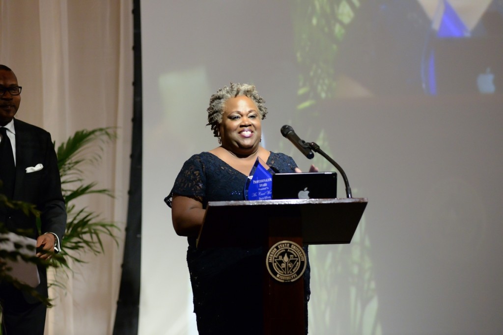 Carol Woodson, director of Events in Community Engagement, accepts her award for Professionalism and Excellence in the Division of Institutional Advancement. (Photo by Darek Ashley/JSU)