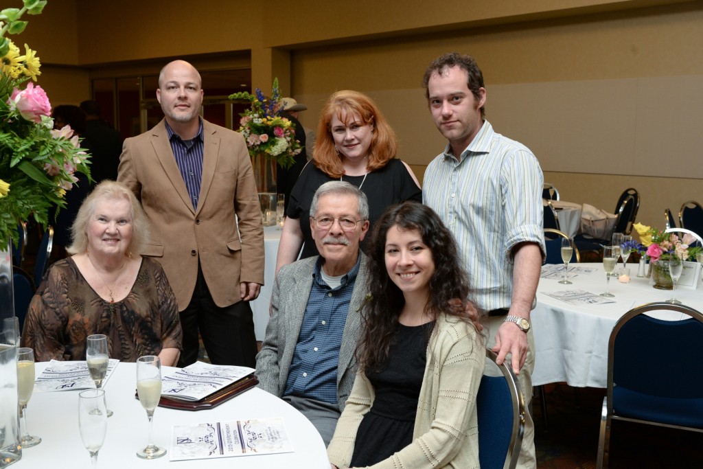 Dr. Mauricio Alegria, assistant professor in the College of Liberal Arts, shares the special moment of his retirement with his family. He worked 27 years at JSU. (Photo by Darek Ashley/JSU)