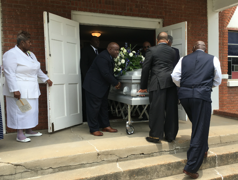 Pallbearers prepare to carry former Jackson State University head football Coach Robert “Bob” Hill, 81, to his final resting place. Hill was named head coach in 1971. He passed away May 17.