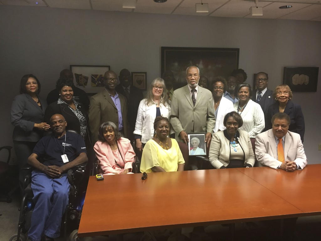 A group of supporters and friends join Charles Holmes (center) as Jackson State University establishes an endowed scholarship in his name in the College of Liberal Arts.