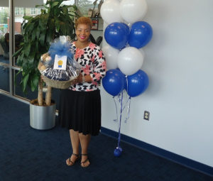 Third-place winner Kelli Olive in the School of Lifelong Learning received a JSU-themed gift basket from the JSU Bookstore.