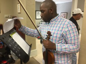 Monquez Ford, a 21-year-old senior in the Department of Music in the Liberal Arts Department, provided entertainment during the Jubilee Picnic on Thursday inside the Walker center. (Photo by L.A. Warren)