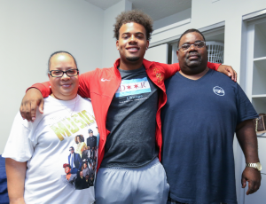 Urban Prep Academy graduate, Michael Taylor II says goodbye to his parents before they return to Chicago
